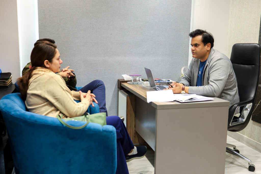 Dr. Wasim Sarwar with patients at AAS Fertility & IVF Center